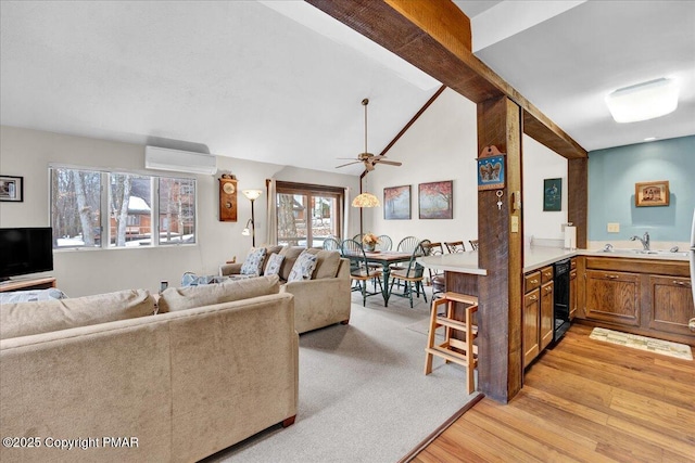 living room featuring vaulted ceiling with beams, light wood-type flooring, ceiling fan, and a wall mounted air conditioner