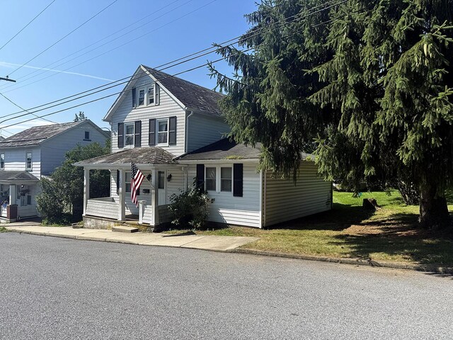 221 Diamond St, Pen Argyl, PA 18072 - view of front of home with a porch and a shingled roof