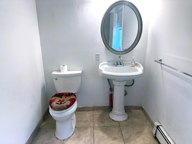 221 Diamond St, Pen Argyl, PA 18072 - half bath featuring baseboard heating and tile patterned floors