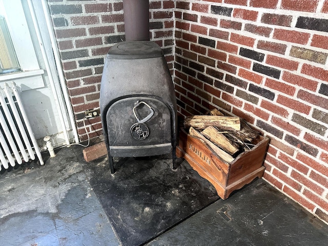 221 Diamond St, Pen Argyl, PA 18072 - detailed view of brick siding and a wood stove