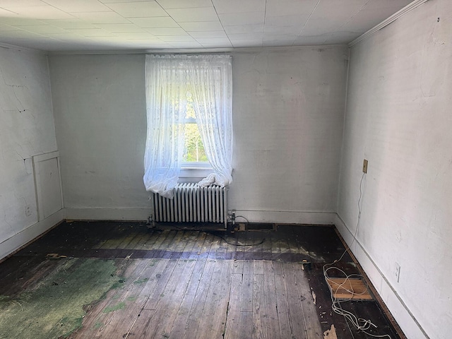 221 Diamond St, Pen Argyl, PA 18072 - empty room featuring wood-type flooring and radiator heating unit