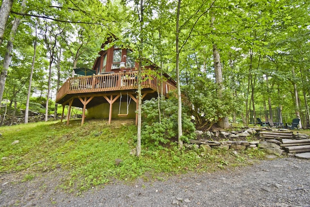 118 Sussex Ct, Bushkill, PA 18324 - rear view of property with a wooden deck and a forest view