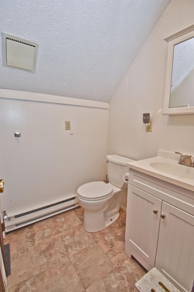 118 Sussex Ct, Bushkill, PA 18324 - half bath featuring a baseboard heating unit, vanity, vaulted ceiling, a textured ceiling, and a decorative wall