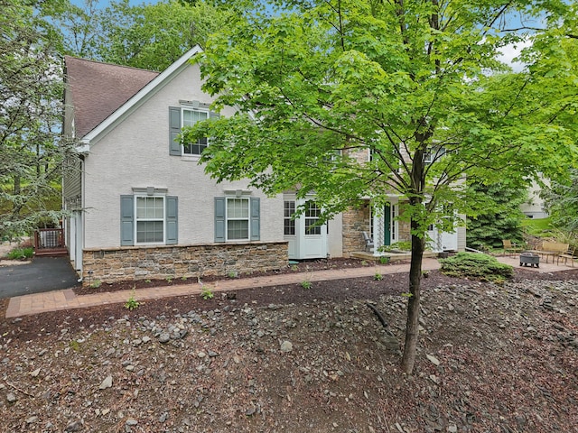 136 Outlook Ct, East Stroudsburg, PA 18302 - view of front of property with a fire pit, stone siding, and stucco siding