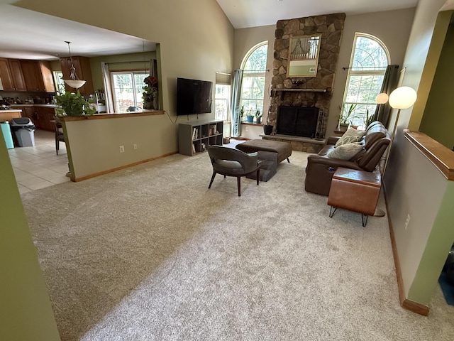 136 Outlook Ct, East Stroudsburg, PA 18302 - living area featuring plenty of natural light, light colored carpet, vaulted ceiling, and a fireplace
