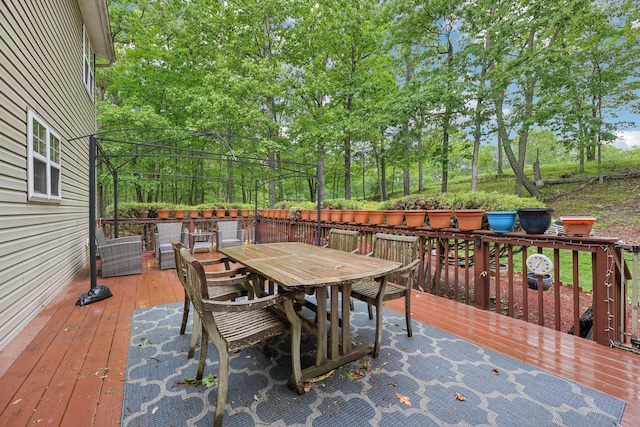 136 Outlook Ct, East Stroudsburg, PA 18302 - wooden terrace with outdoor dining area and view of scattered trees