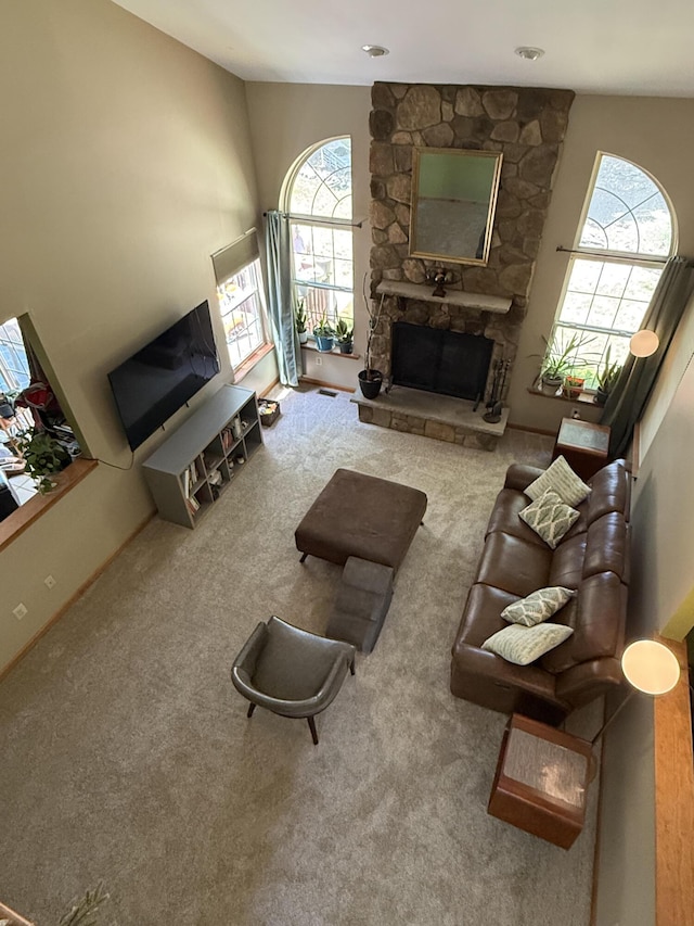 136 Outlook Ct, East Stroudsburg, PA 18302 - carpeted living area featuring a stone fireplace