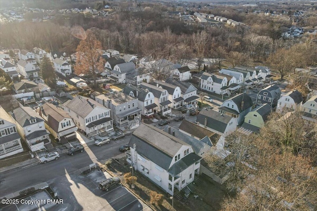 birds eye view of property with a residential view