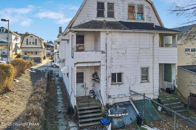 back of property with a gambrel roof