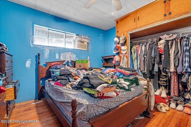 bedroom with a closet and wood finished floors