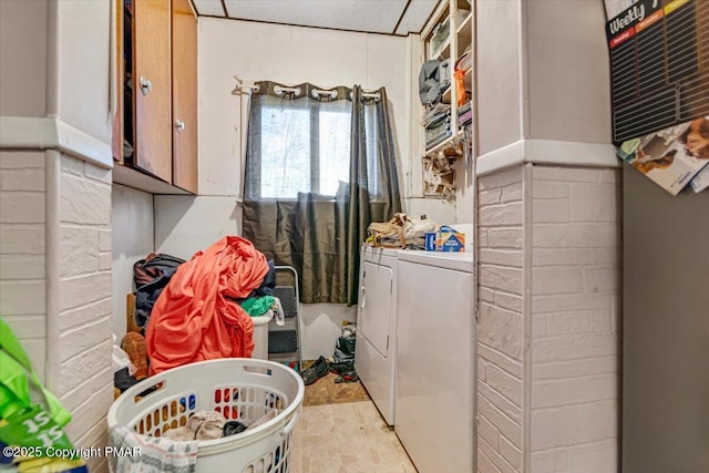 laundry room featuring cabinet space and washer and dryer