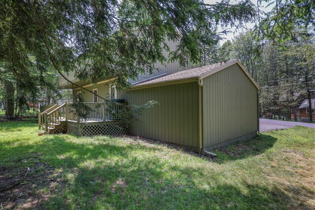 3055 Briarwood Dr, Tobyhanna, PA 18466 - view of side of property featuring a lawn and a deck