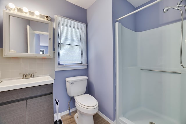 3055 Briarwood Dr, Tobyhanna, PA 18466 - full bathroom with backsplash, a shower, vanity, and wood finished floors
