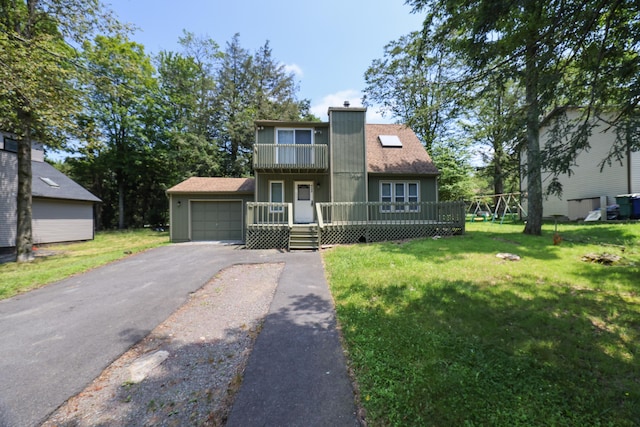 3055 Briarwood Dr, Tobyhanna, PA 18466 - view of front of home with asphalt driveway, an attached garage, a front lawn, a balcony, and a wooden deck
