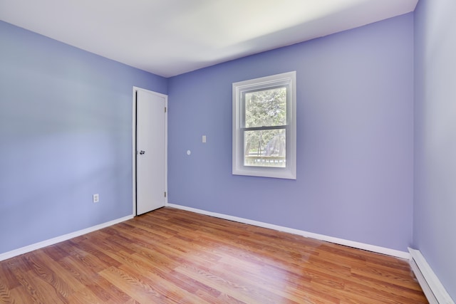 3055 Briarwood Dr, Tobyhanna, PA 18466 - empty room with a baseboard radiator and light wood finished floors