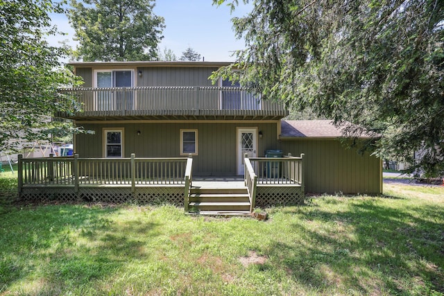 3055 Briarwood Dr, Tobyhanna, PA 18466 - back of property with a lawn and a wooden deck