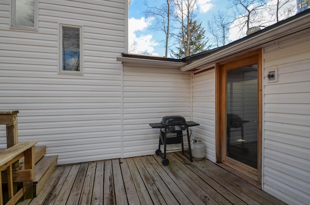 wooden terrace featuring grilling area