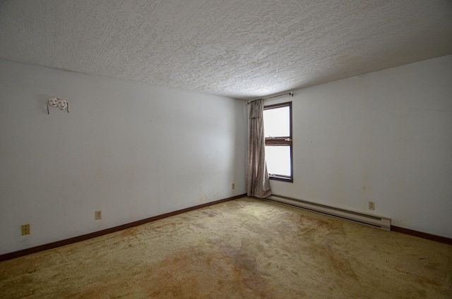 spare room featuring a textured ceiling, a baseboard radiator, carpet flooring, and baseboards