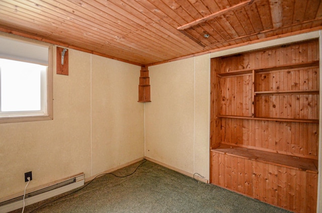 unfurnished room with a baseboard heating unit, carpet, and wood ceiling