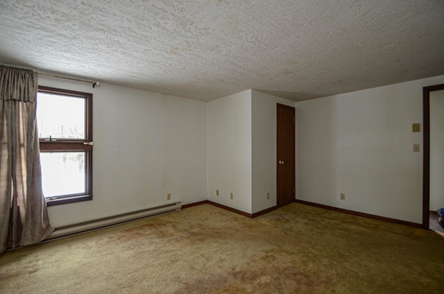 empty room featuring carpet floors, baseboards, baseboard heating, and a textured ceiling