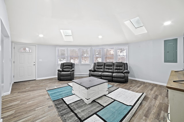 202 Palomino Pl, Tobyhanna, PA 18466 - living area featuring a skylight, wood finished floors, electric panel, baseboards, and lofted ceiling