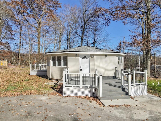 202 Palomino Pl, Tobyhanna, PA 18466 - view of front facade with a wooden deck and roof with shingles