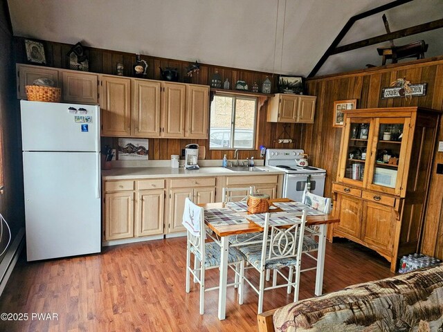 1123 Porter Dr, Bushkill, PA 18324 - kitchen with white appliances, vaulted ceiling, light countertops, light wood-type flooring, and a sink