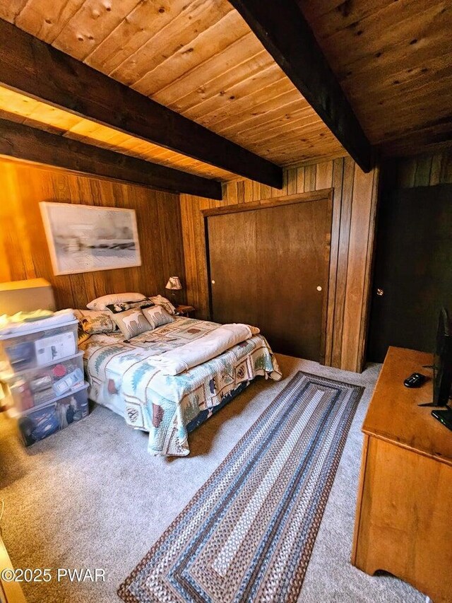 1123 Porter Dr, Bushkill, PA 18324 - bedroom with carpet floors, wooden walls, beamed ceiling, and wooden ceiling