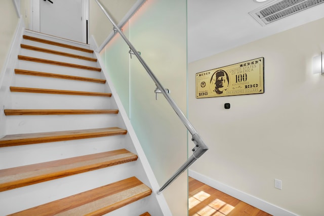 264 Maloney Ln, Tannersville, PA 18372 - stairs featuring wood finished floors, baseboards, and visible vents