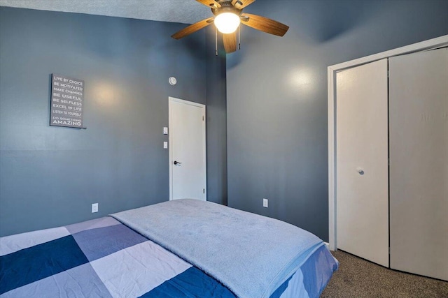 bedroom with carpet, a closet, and ceiling fan