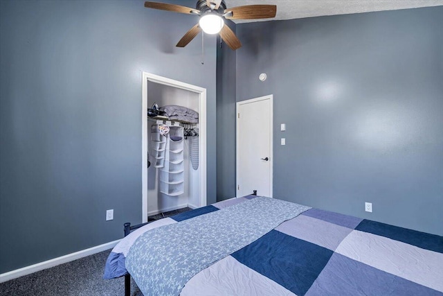 carpeted bedroom featuring high vaulted ceiling, a closet, ceiling fan, and baseboards