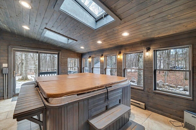 interior space with lofted ceiling with skylight, wood walls, wood ceiling, and recessed lighting