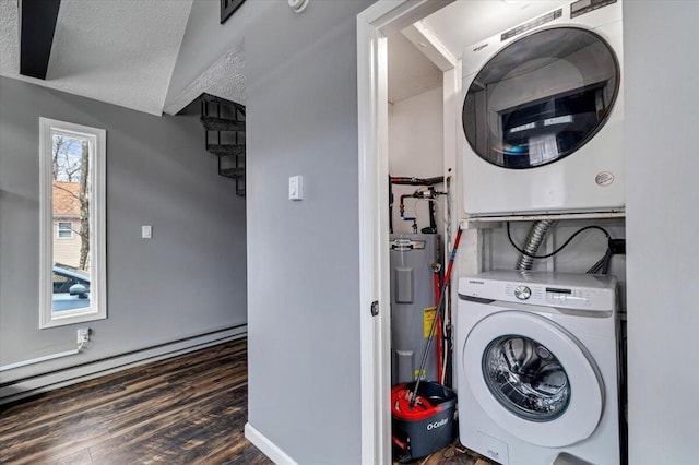 washroom with laundry area, stacked washer / drying machine, a textured ceiling, water heater, and a baseboard heating unit