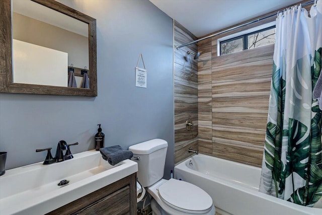 bathroom with shower / tub combo with curtain, vanity, and toilet