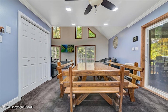 dining space with ornamental molding, ceiling fan, and dark colored carpet