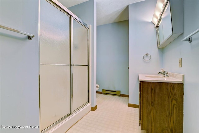 full bathroom featuring a shower stall, baseboards, toilet, vanity, and a baseboard radiator