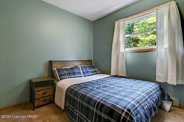 carpeted bedroom with baseboards