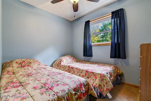 bedroom with baseboards, carpet floors, and ceiling fan