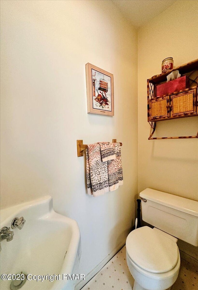 half bathroom featuring a sink and toilet