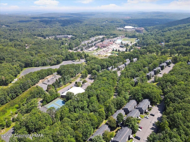 birds eye view of property with a residential view and a view of trees