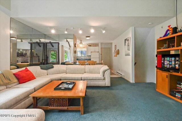 living room with a baseboard heating unit, carpet, rail lighting, and a ceiling fan