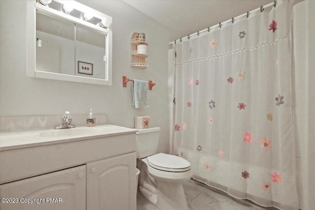 bathroom featuring toilet and vanity