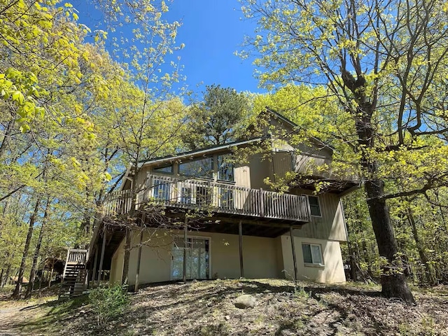 251 Dorchester Dr, Bushkill, PA 18324 - view of front of property with a wooden deck and stairs