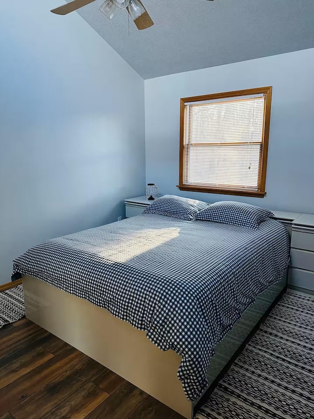 251 Dorchester Dr, Bushkill, PA 18324 - bedroom featuring lofted ceiling, dark wood-style flooring, a textured ceiling, and ceiling fan