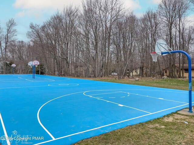 view of sport court with community basketball court and a lawn