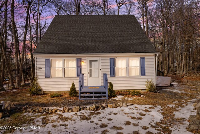 view of front of home with a shingled roof