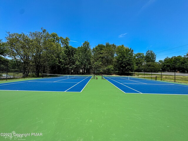 view of sport court with community basketball court and fence