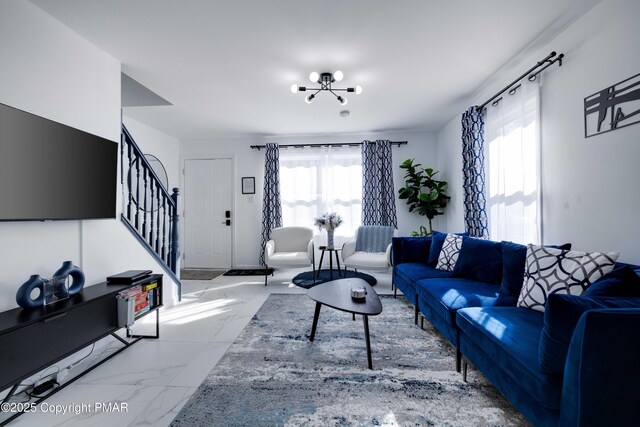 living area featuring marble finish floor and stairway