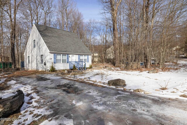 view of front of home featuring a shingled roof