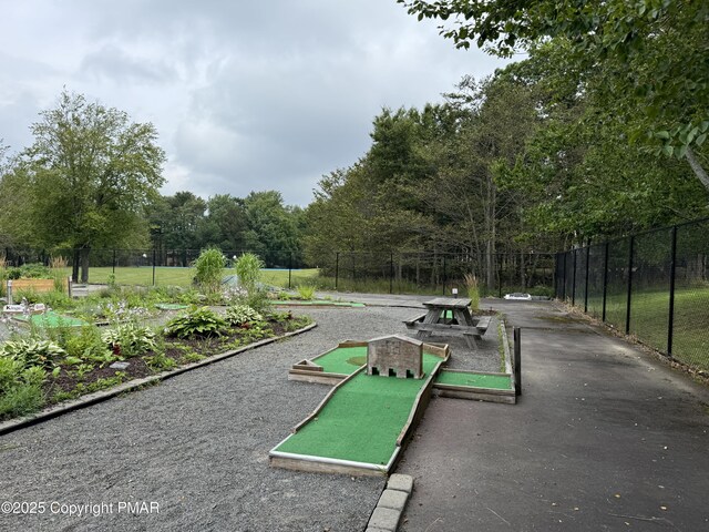 view of property's community with fence